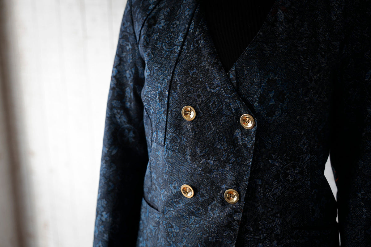 The front panels and gold buttons, up close.